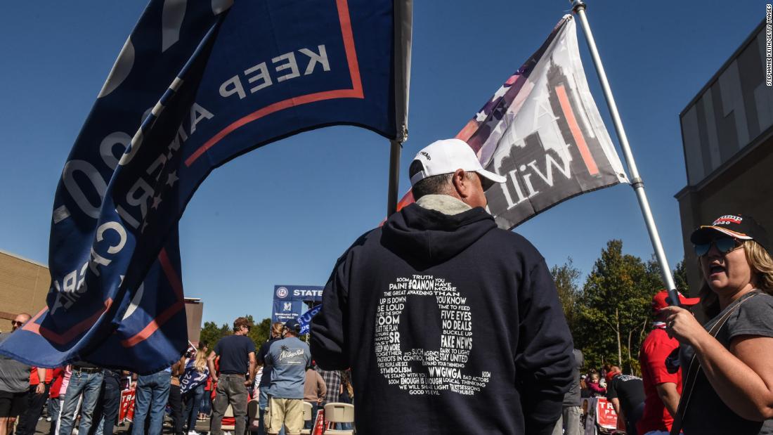 A man wears a QAnon sweatshirt during a pro-Trump rally on October 3, 2020 in the borough of Staten Island in New York City. The event was held to encourage supporters to pray for Trump&#39;s health after he contracted Covid-19.