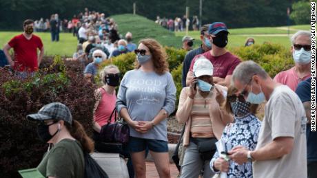 Voters wait in line to cast their ballot at an early voting location in Fairfax, Virginia on September 18, 2020. - Early in-person voting for the 2020 general election kicked off on September 18, 2020 in Virginia (Photo by ANDREW CABALLERO-REYNOLDS / AFP) (Photo by ANDREW CABALLERO-REYNOLDS/AFP via Getty Images)