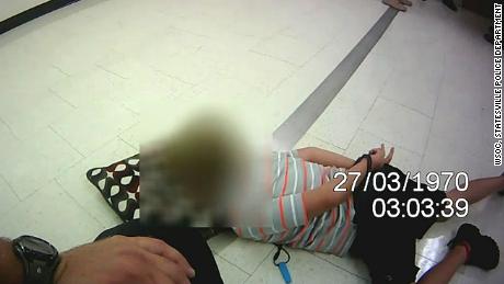 The lawsuit alleges the boy was held on the ground, handcuffed, for more than 38 minutes. 
