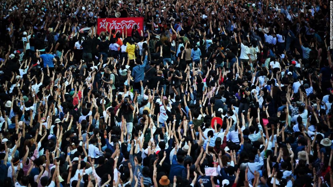 Protesters hold up the three-finger salute en masse on October 15.