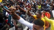 Demonstrators gesture during a protest in Lagos, Nigeria, on Wednesday, October 14.