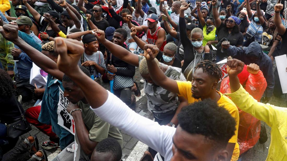 Demonstrators gesture during a protest in Lagos on October 14.