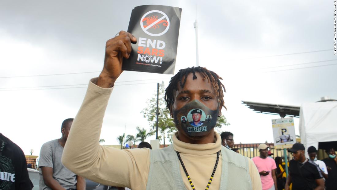 A protester displays a placard in Ikeja on October 13.