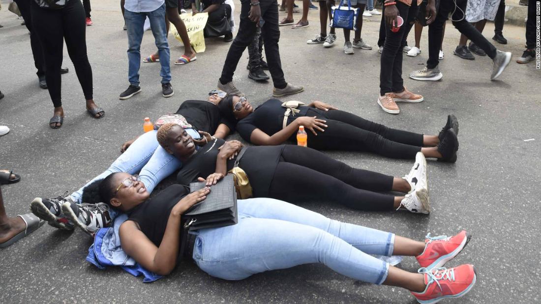 Protesters lie on the road along the Lagos-Ibadan Expressway.