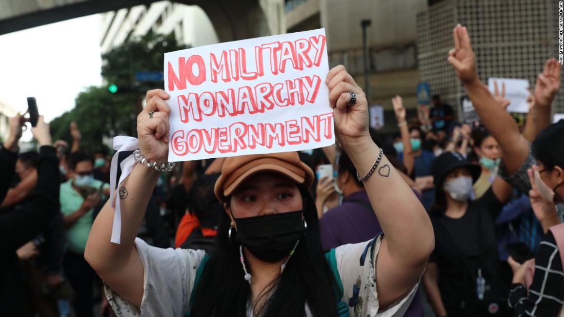 A pro-democracy protester holds up a sign during a rally on October 15.