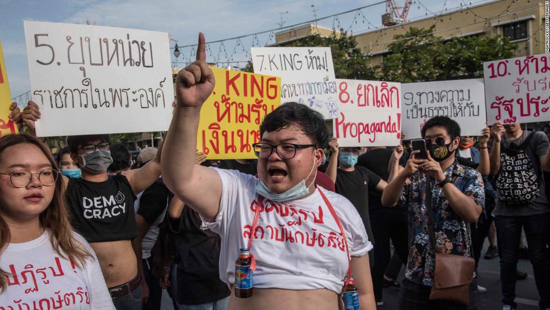 Parit &quot;Penguin&quot; Chiwarak, 22, a student and one of the leaders of the pro-democracy movement, is allowed by police to read a 10-point manifesto on reforming the monarchy.