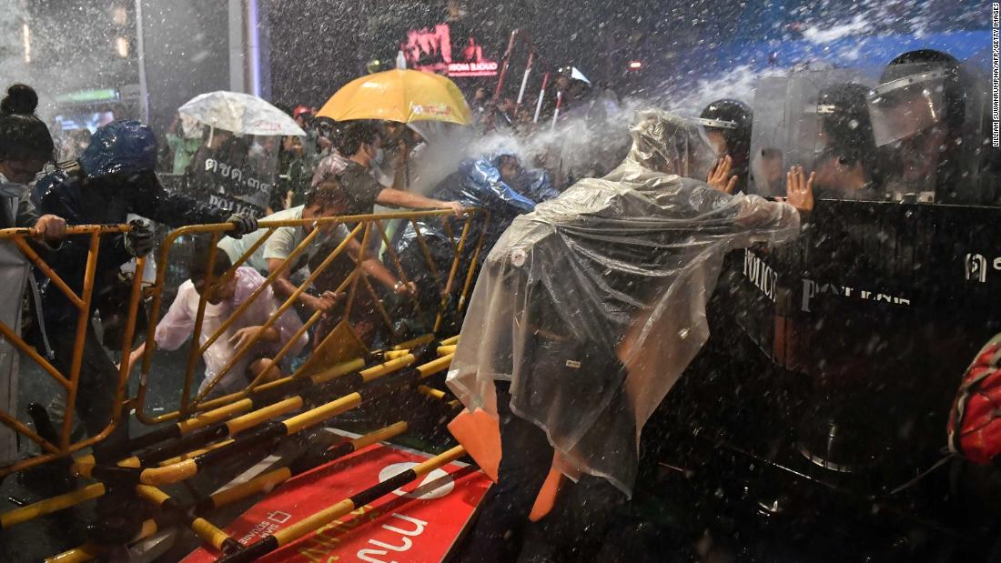 Police fire water cannons at pro-democracy protesters during an anti-government rally in Bangkok on Friday, October 16.