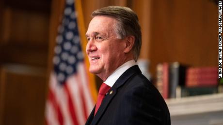 Senator David Perdue, R-GA, poses for a photo with Judge Amy Coney Barrett, President Donald Trumps nominee for Supreme Court, before a meeting at the US Capitol on September 30, 2020, in Washington, DC. (Photo by Anna Moneymaker / POOL / AFP) (Photo by ANNA MONEYMAKER/POOL/AFP via Getty Images)