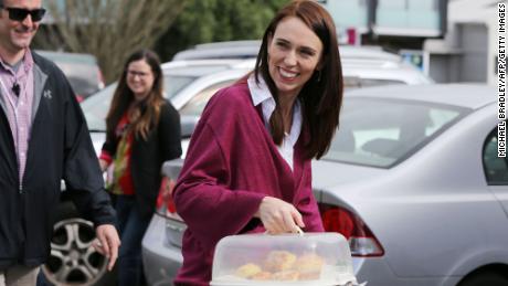 Labour Leader Jacinda Ardern arrives with scones as she visits Labour Election Day volunteers in Auckland on October 17, 2020. 