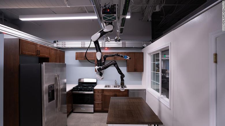 Toyota Research Institute (TRI) is developing human-assist robots in its labs in California. This &quot;gantry robot&quot; is adapted for the home from a style more often seen in assembly and manufacturing lines. Since these robots hang from the ceiling like a bat, they save floor space and can reach other machines and parts easily from above. This TRI robot is able to complete tasks such as loading the dishwasher. 