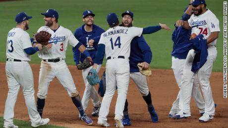 The Dodgers celebrate after beating the Braves.