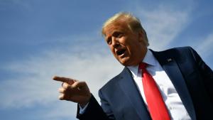 TOPSHOT - US President Donald Trump speaks to members of the media upon arrival at Phoenix Sky Harbor International Airport in Phoenix, Arizona on October 19, 2020. Trump is heading to Prescott, Arizona for a campaign rally. - US President Donald Trump went after top government scientist Anthony Fauci in a call with campaign staffers on October 19, 2020, suggesting the hugely respected and popular doctor was an &quot;idiot.&quot; (Photo by MANDEL NGAN / AFP) (Photo by MANDEL NGAN/AFP via Getty Images)