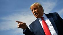 TOPSHOT - US President Donald Trump speaks to members of the media upon arrival at Phoenix Sky Harbor International Airport in Phoenix, Arizona on October 19, 2020. Trump is heading to Prescott, Arizona for a campaign rally. - US President Donald Trump went after top government scientist Anthony Fauci in a call with campaign staffers on October 19, 2020, suggesting the hugely respected and popular doctor was an &quot;idiot.&quot; (Photo by MANDEL NGAN / AFP) (Photo by MANDEL NGAN/AFP via Getty Images)