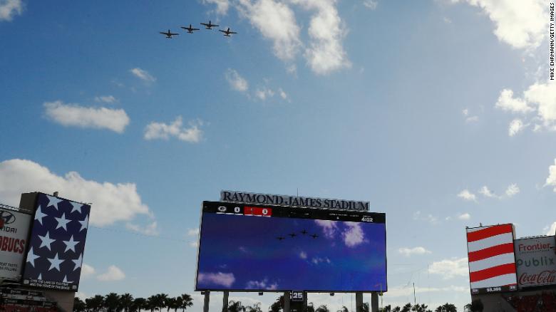 Airplanes fly over Raymond James Stadium before the start of the game between the Tampa Bay Buccaneers and the Green Bay Packers on Sunday.
