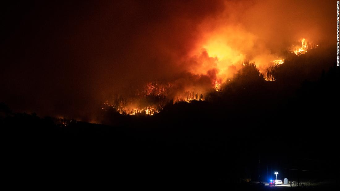 Flames from the Cameron Peak Fire, the largest wildfire in Colorado history, work their way along a ridge outside Estes Park on October 16.