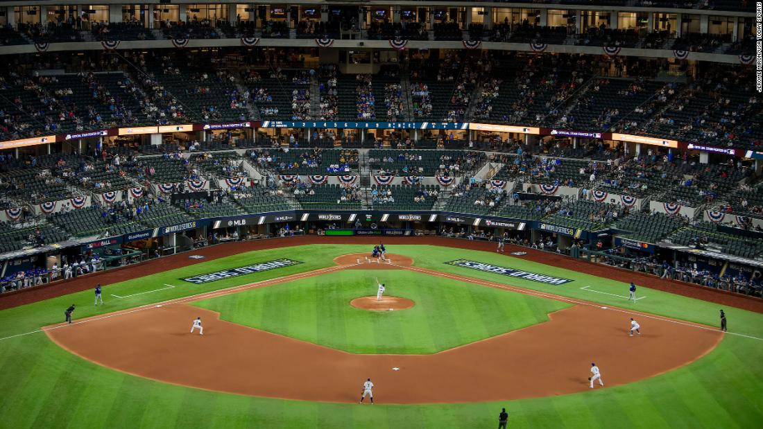 Dodgers pitcher Clayton Kershaw delivers the first pitch of the 2020 World Series at Globe Life Field in Arlington.