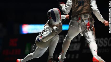 Eva Hampel of Germany (R) competes against Thibus of France during the women&#39;s foil team competition at the 2018 World Fencing Championships in Wuxi in China&#39;s eastern Jiangsu province in July 2018.