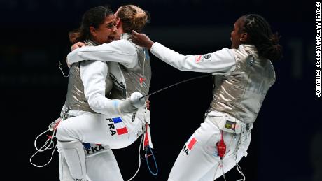 Thibus (L) of France celebrates with his team after winning against Jeon Her Sook of South Korea after the women&#39;s foil team competition final at the 2018 World Fencing Championships in Wuxi in China&#39;s eastern Jiangsu province in July 2018.