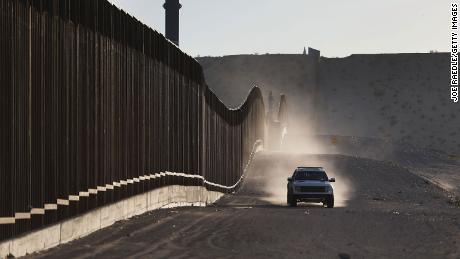 A US Border Patrol vehicle drives along the Mexico border fence on June 24, 2018, in Sunland Park, New Mexico. 