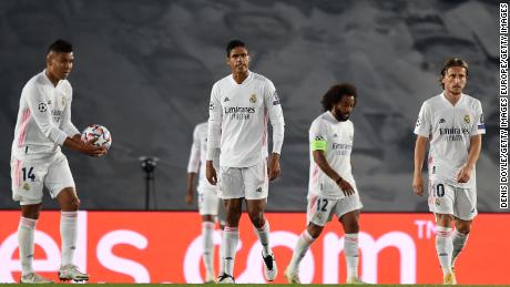 Real Madrid&#39;s players look bewildered as Shakhtar scores its third goal.