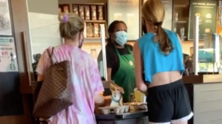 White woman caught on video yelling obscenities at a Black Starbucks barista over face mask