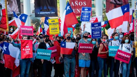 People demonstrate against changing the constitution in Santiago on Oct. 21.
