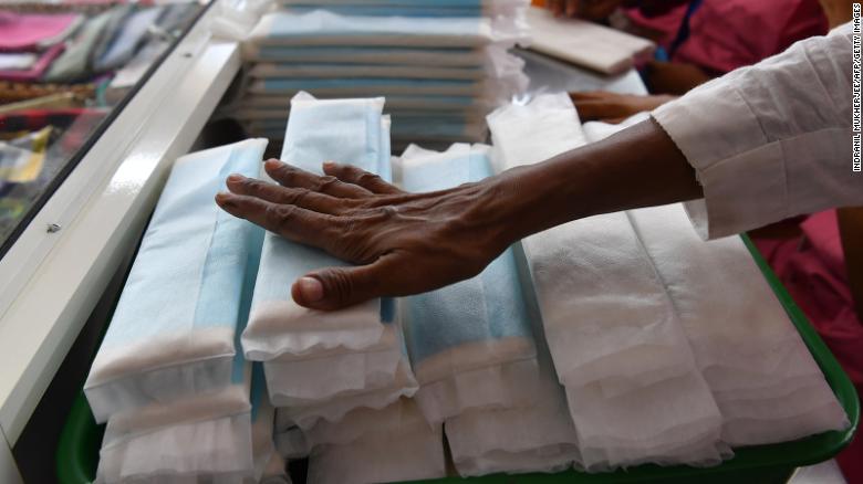 Employees of Myna Mahila Foundation, an Indian charity championing menstrual hygiene, prepare sanitary pads at their office in Mumbai on April 10, 2018. 