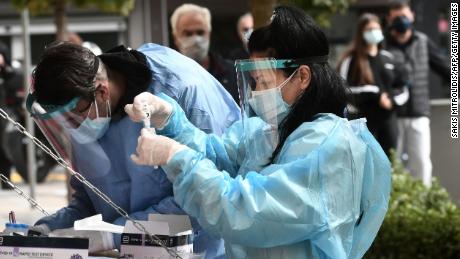 A health worker checks a coronavirus test in Kozani, Greece, on October 16, 2020.