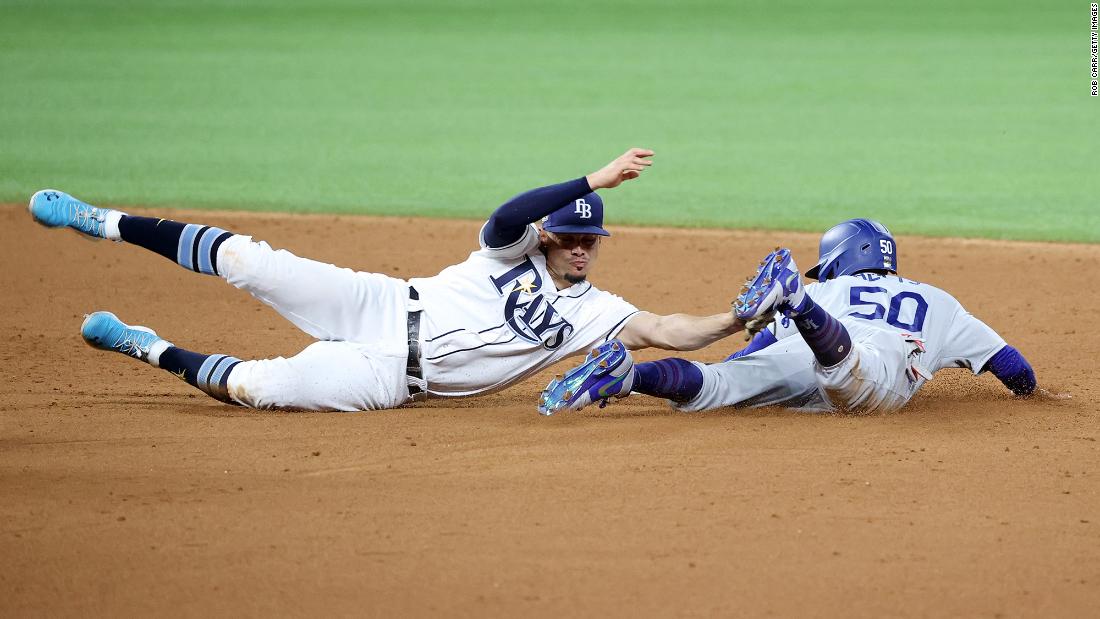 The Dodgers&#39; Mookie Betts  steals second base against Willy Adames during the sixth inning of Game 3.