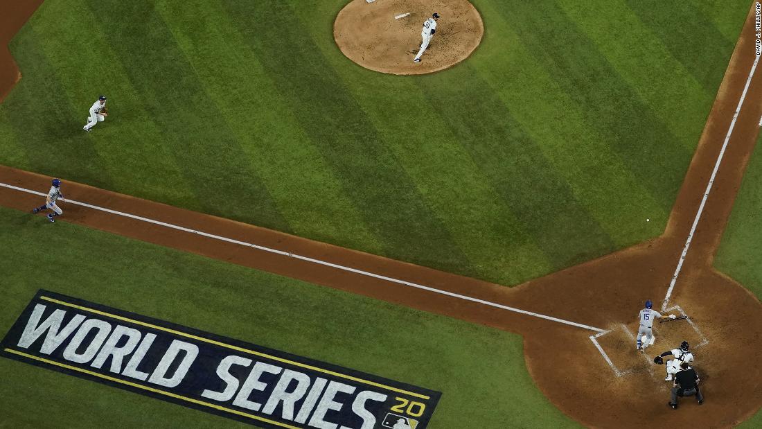 The Dodgers&#39; Austin Barnes lays down a RBI bunt during Game 3&#39;s fourth inning.