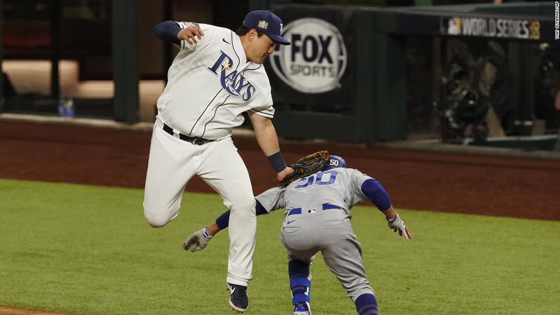 The Dodgers beat the Rays 6-2 in Game 3 on Friday, October 23, taking a 2-1 series lead. Here, Rays&#39; first baseman Ji-Man Choi tags out Mookie Betts at first base during the eighth inning.