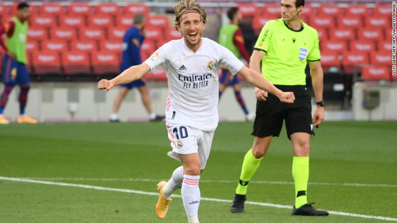 Modric celebrates after scoring against Barcelona.