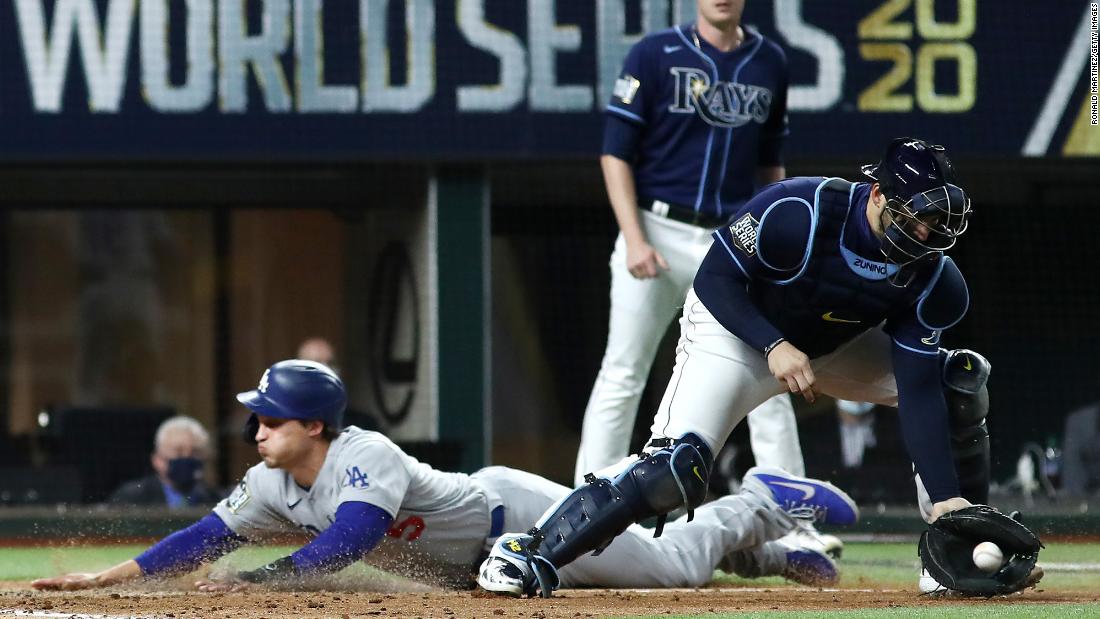 The Dodgers&#39; Corey Seager slides into home plate safely with a run against the Rays during the fifth inning. 