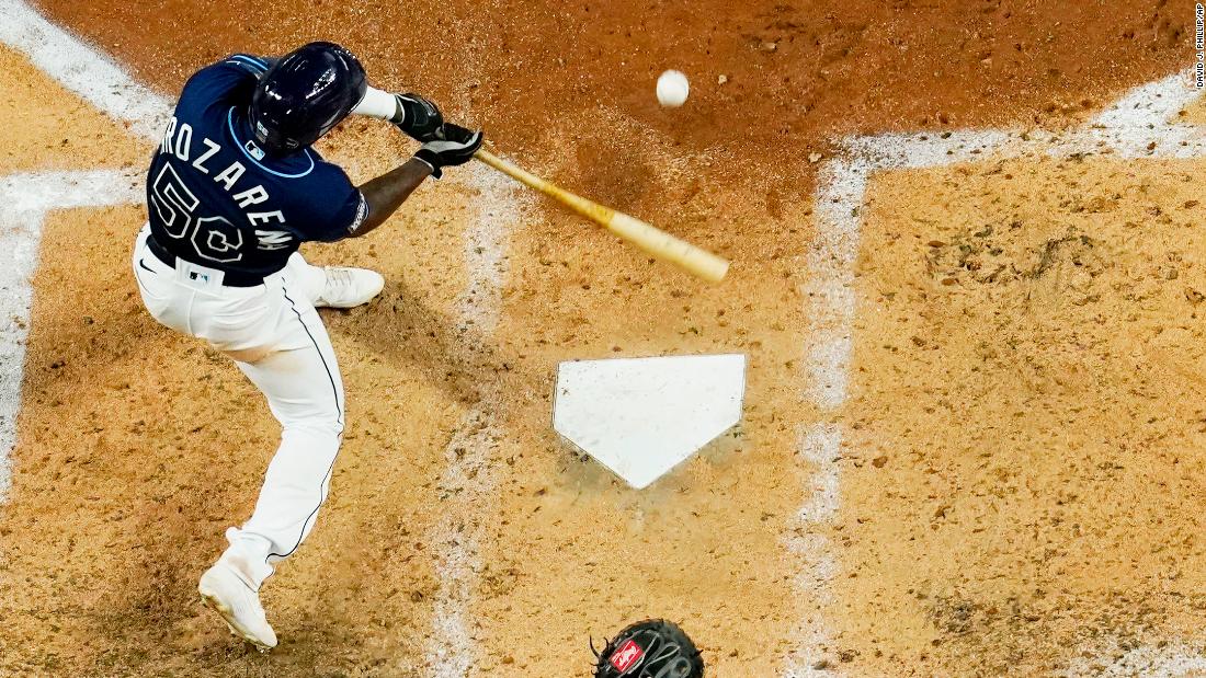 The Rays&#39; Randy Arozarena hits a home run against the the Dodgers during the fourth inning. 
