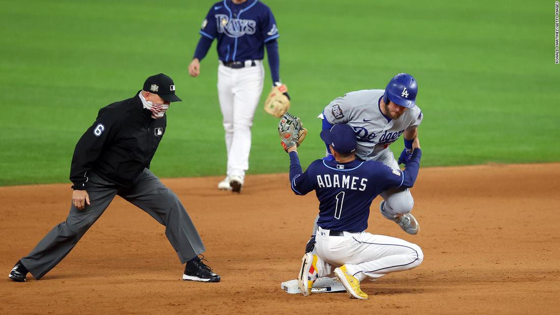 The Dodgers&#39; Max Muncy is tagged out at second base by the Rays&#39; Willy Adames during the fifth inning. 