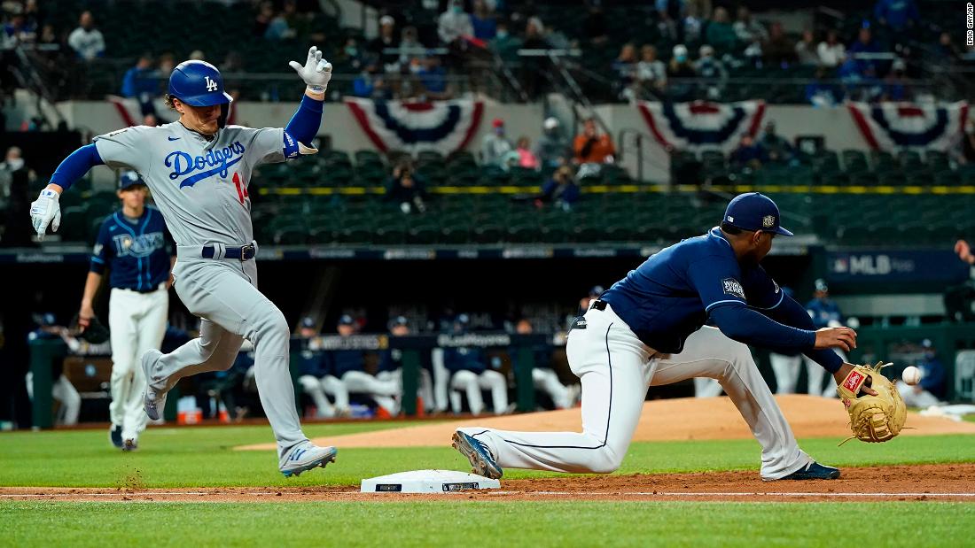 The Dodgers&#39; Enrique Hernandez is forced out at first by the Rays&#39; first baseman Yandy Diaz during the third inning. 