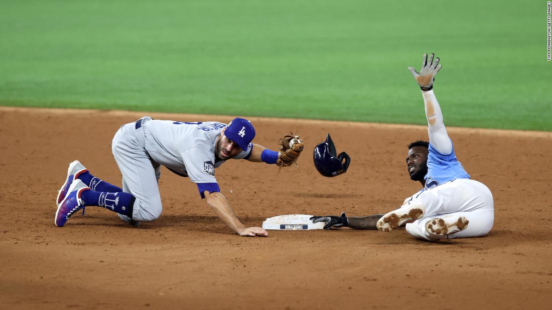 Chris Taylor of the Dodgers successfully tags out the Rays&#39; Randy Arozarena as he attempted to steal second base during the third inning. 
