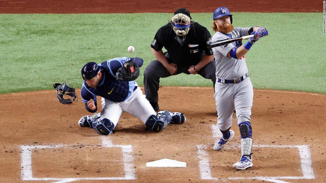 Rays catcher Mike Zunino is unable to field a wild pitch with Justin Turner of the Dodgers at the plate during the first inning. 