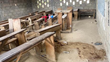 Sand covers a puddle of blood in an empty classroom following the shooting in Cameroon.