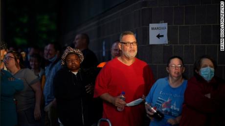 Hundreds of people line up outside the Kentucky Career Center, over two hours prior to its opening, to find assistance with their unemployment claims in Frankfort, Kentucky, U.S. June 18, 2020. REUTERS/Bryan Woolston