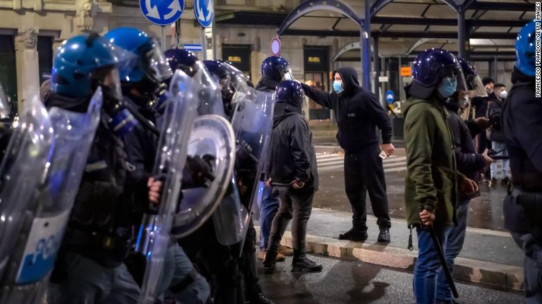 Protesters clash with police in northern Italy as anger mounts over Covid-19 restrictions