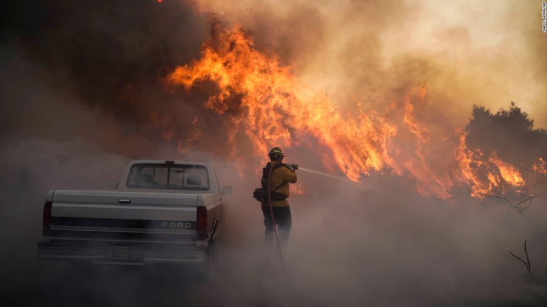 Firefighter Raymond Vasquez battles the Silverado Fire in Irvine on Monday, October 26.