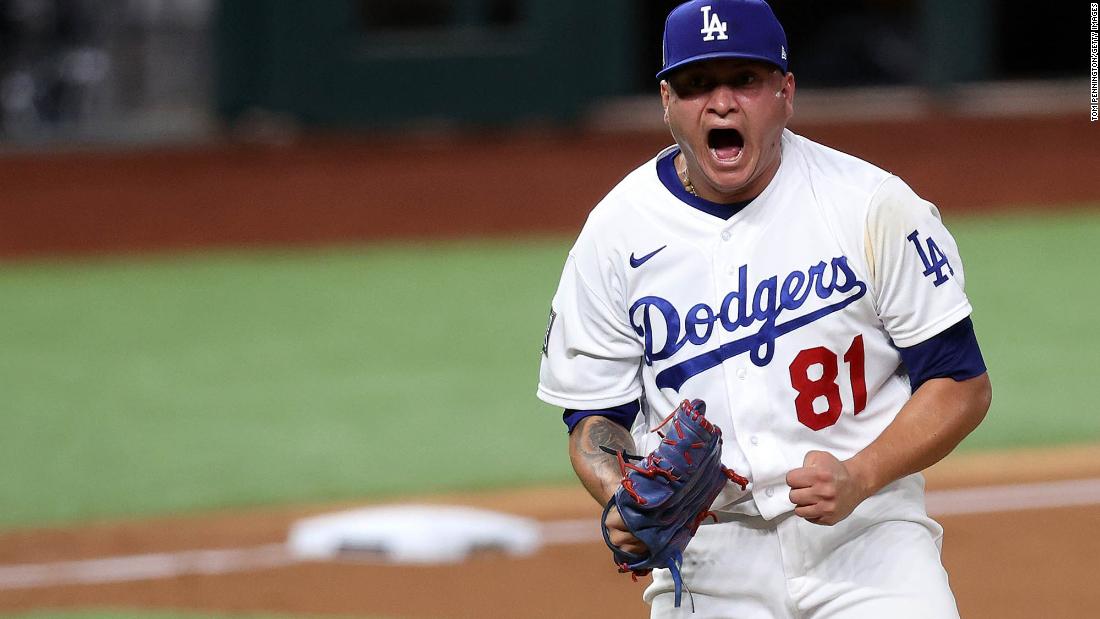 Victor Gonzalez of the Los Angeles Dodgers celebrates after striking out the side against the Tampa Bay Rays during the sixth inning.