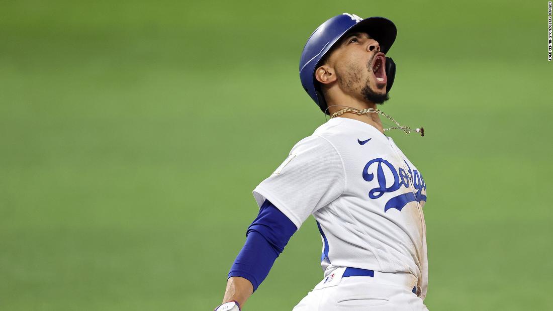 Los Angeles Dodgers&#39; Mookie Betts celebrates after a home run against the Tampa Bay Rays during the eighth inning of Game 6. 