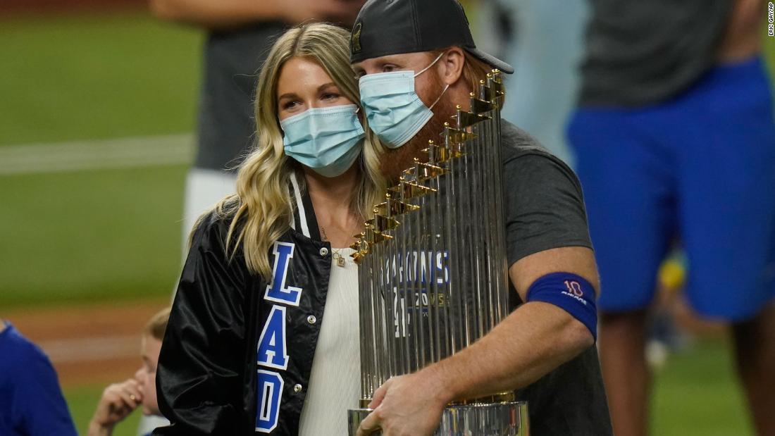 Dodgers third baseman Justin Turner celebrates with the trophy. He had to be pulled in the middle of Game 6 &lt;a href=&quot;https://www.cnn.com/2020/10/28/sport/justin-turner-coronavirus-los-angeles-dodgers-world-series-spt-intl/index.html&quot; target=&quot;_blank&quot;&gt;after testing positive for Covid-19.&lt;/a&gt; He returned to the field for the postgame celebrations.