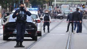 French policemen stand guard a street after a knife attack in Nice on October 29, 2020. - A man wielding a knife outside a church in the southern French city of Nice slit the throat of one person, leaving another dead and injured several others in an attack on Thursday morning, officials said. The suspected assailant was detained shortly afterwards, a police source said, while interior minister Gerald Darmanin said on Twitter that he had called a crisis meeting after the attack. (Photo by Valery HACHE / AFP) (Photo by VALERY HACHE/AFP via Getty Images)