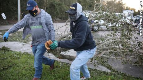 Workers clear debris from Hurricane Zeta Thursday at St. Bernard Middle School in St. Bernard, Louisiana. 