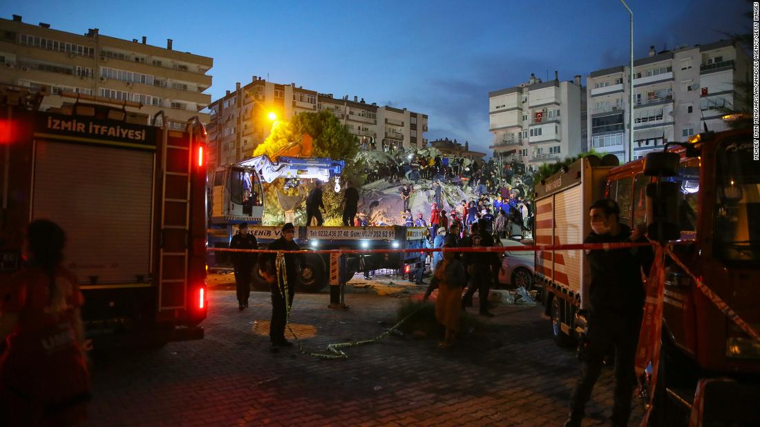 Search-and-rescue work is conducted at a collapsed building in Izmir.
