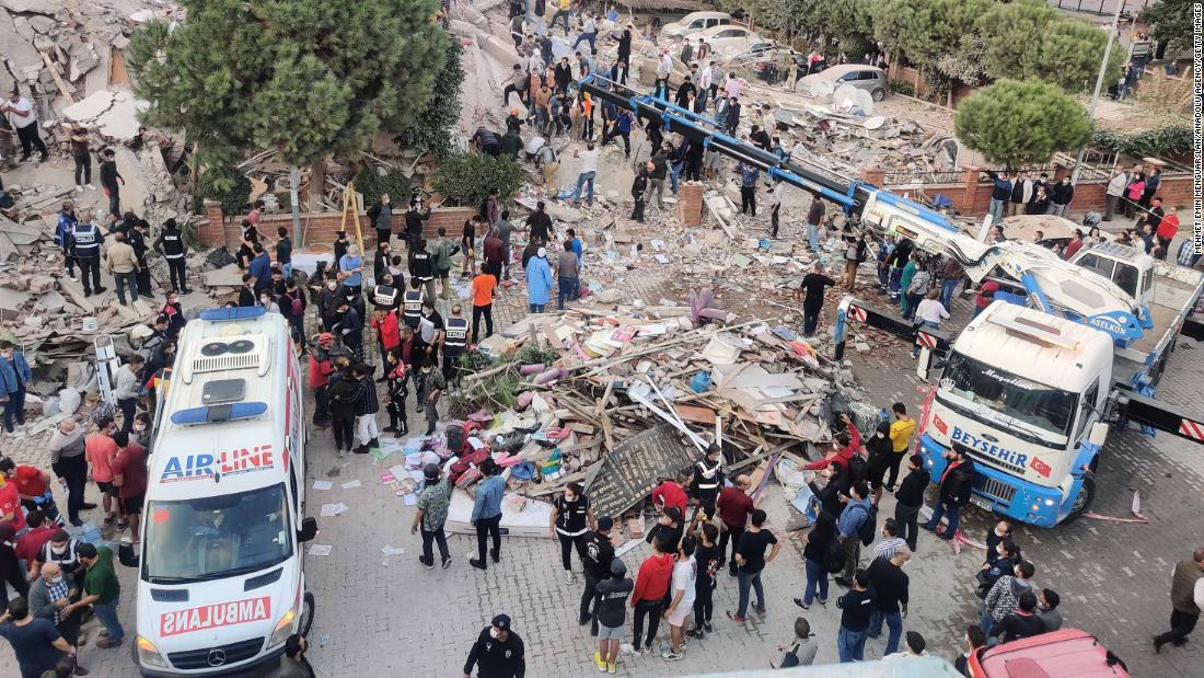 Search and rescue operations take place at a building in Izmir.