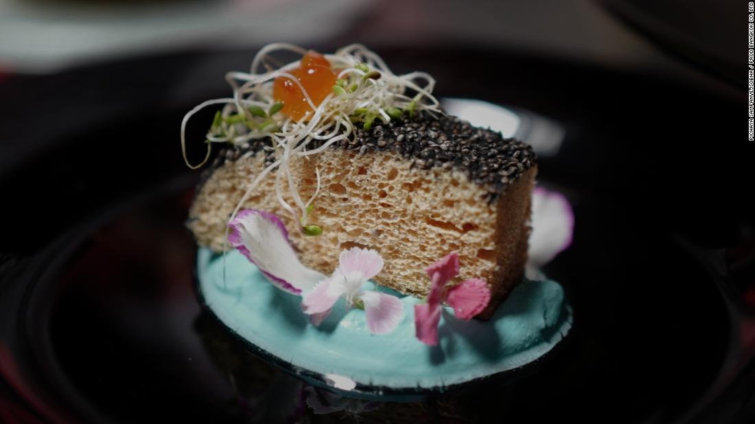 In this dish, the feather-based protein is transformed into a &quot;fish fillet,&quot; flavored with salt water and crusted with chia seeds. It&#39;s served with a creamy seafood sauce, garnished with dill and topped with salmon roe.